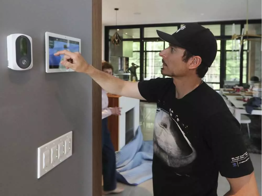 A touch screen control near the front door allows Alex Tagliani to turn everything in his home on or off. (John Kenney / Montreal Gazette)